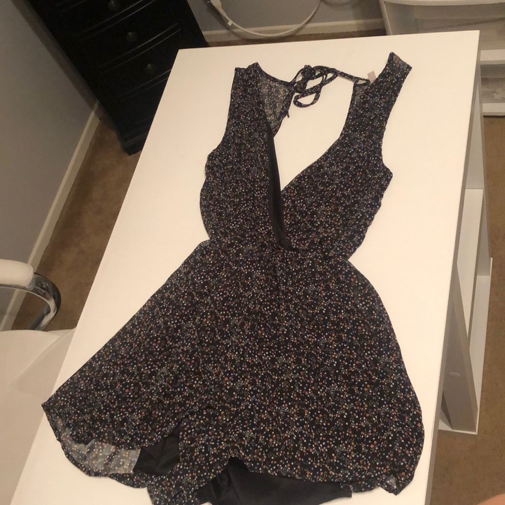 Black floral romper in a size small